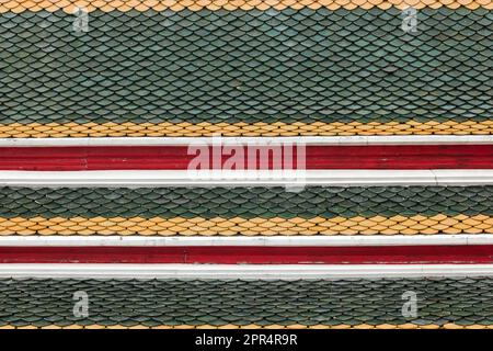 Terracotta tiles are stacked into layers. Popularly made into a Thai temple roof Stock Photo