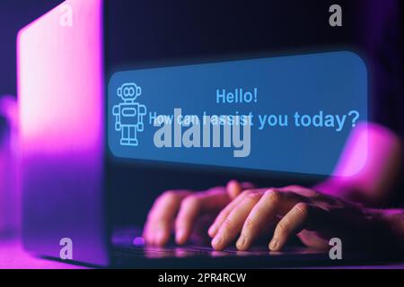 AI Chatbot assistant. Artificial intelligence robot chat with human. Close up shot of hands and laptop keyboard Stock Photo