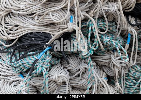 Retro fishing nets in bags, close-up. A pile of old fishing net Stock Photo