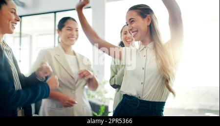 Business woman dance, celebration and staff dancing with a smile feeling happiness together. Management, company office growth and success of women Stock Photo