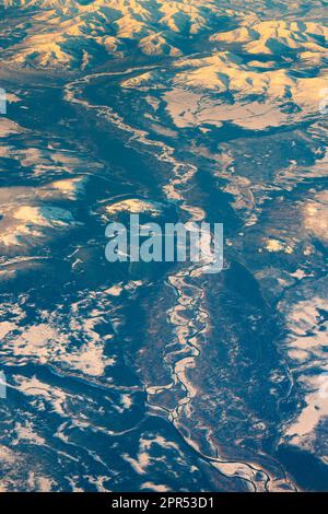 Aerial view of frozen mountains and rivers in the North Pole Stock Photo