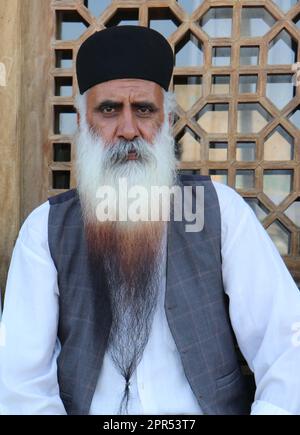 1 old Kurdish man with a very long beard and traditional Kurdish clothes Stock Photo