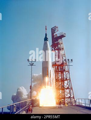 Mercury-Atlas 9 lifts off from Pad 14 at Cape Canaveral with astronaut L. Gordon Cooper aboard Faith 7 for the nation's longest manned orbital flight. Lift-off occurred at 8:04 a.m. EST, on May 15, 1963. And 34 hours, 20 minutes, 30 seconds, and 22 orbits later, Gordon Cooper was resting in his Faith 7 space capsule in the blue Pacific Ocean. Stock Photo
