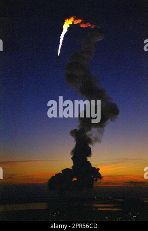 Flames from the solid rocket boosters light up the clouds of smoke and steam trailing behind Space Shuttle Atlantis as it lifts off into the pre-dawn sky on mission STS-101. Liftoff occurred on time at 6:11:10 a.m. (EDT), May 19, 2000. The mission took the crew of seven to the International Space Station to deliver logistics and supplies as well as to prepare the Station for the arrival of the Zvezda Service Module, launched by Russia on July 12, 2000. This was the third assembly flight to the Space Station and the 98th Shuttle flight and the 21st flight for Shuttle Atlantis. After a nearly 10 Stock Photo