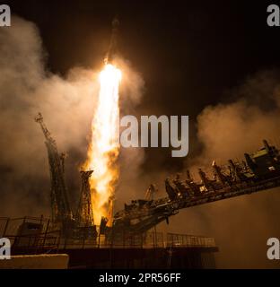 The Soyuz MS-08 rocket is launched with Expedition 55 Soyuz Commander Oleg Artemyev of Roscosmos and flight engineers Ricky Arnold and Drew Feustel of NASA, Wednesday, March 21, 2018 at the Baikonur Cosmodrome in Kazakhstan. Artemyev, Arnold, and Feustel will spend the next five months living and working aboard the International Space Station.  Photo Credit: (NASA/Joel Kowsky) Stock Photo