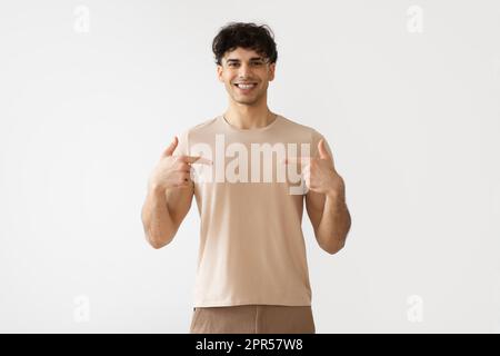Middle Eastern Man Pointing Fingers At Himself Over White Background Stock Photo