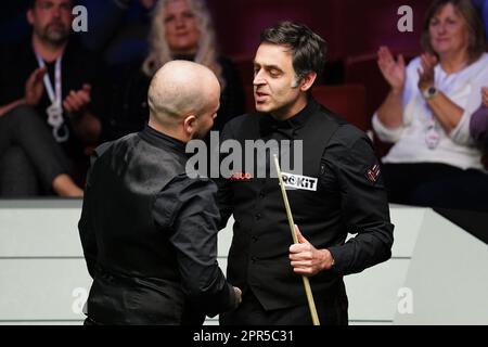 Ronnie O'Sullivan congratulates Luca Brecel (left) on day twelve of the Cazoo World Snooker Championship at the Crucible Theatre, Sheffield. Picture date: Wednesday April 26, 2023. Stock Photo