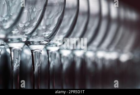 Row Of Empty Glass Wine Glasses On A Shelf Stock Photo