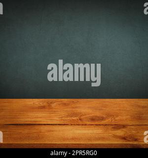 The background is blank wooden boards and a textured plastered wall with lighting and vignetting. Stock Photo