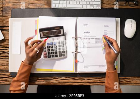 Businessperson Calculating Tax Stock Photo