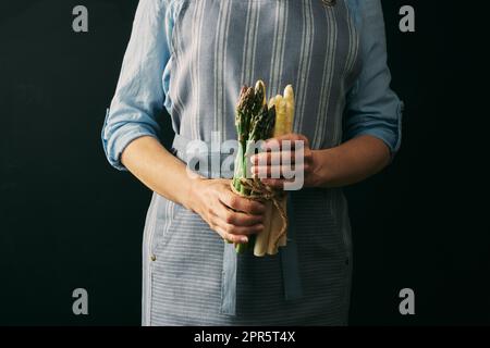 Anonymous woman with green and white asparagus Stock Photo