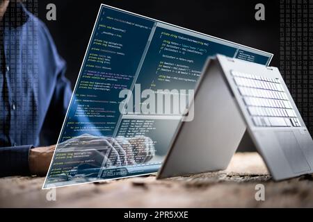 Computer Programmer Writing Program Code On Computer Stock Photo