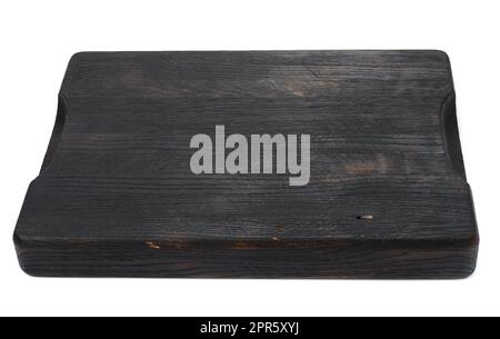 empty rectangular black wooden cutting kitchen board on a white isolated background Stock Photo