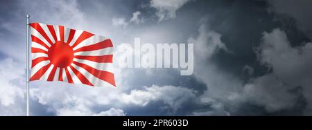 Japanese naval ensign flag on a cloudy sky Stock Photo