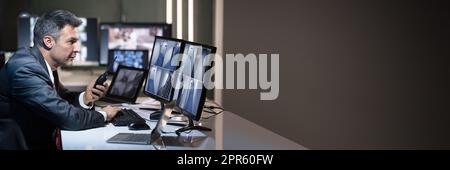 Side View Of A Businessman Talking On Walkie Talkie Stock Photo