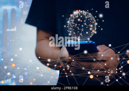 Hand use smartphone global business Internet network connection and social media. Businessman concept holding a global network of futuristic technology background. Stock Photo