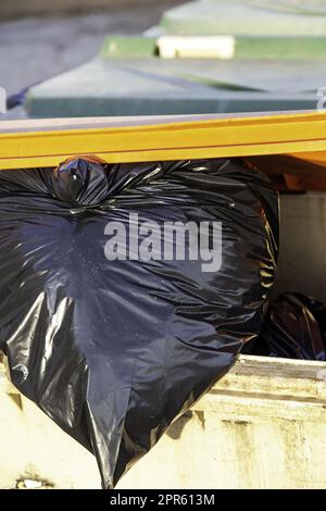 Containers with garbage bags Stock Photo
