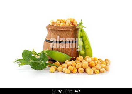 dry-whole-yellow-peas-and-sweet-green-peas-with-green-leaves-on-white