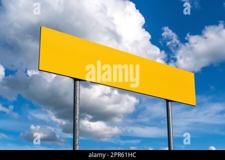 Blank yellow road sign on sky background Stock Photo