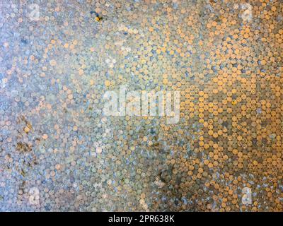 Very many old Icelandic coins on the ground - money concept taken from above. Stock Photo