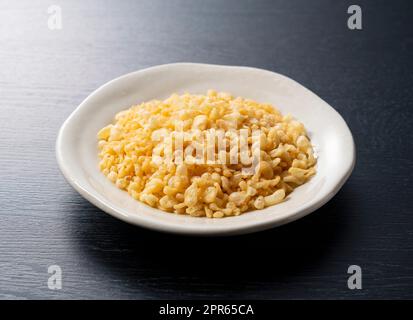 Tenkasu on a plate placed on a black background. Stock Photo
