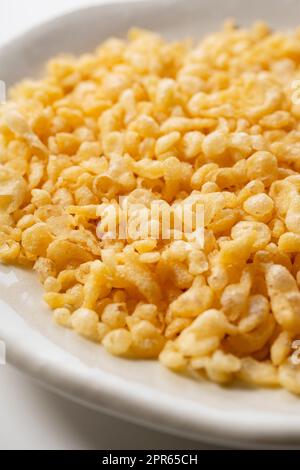 Tenkasu served on a plate placed on a white background. Stock Photo