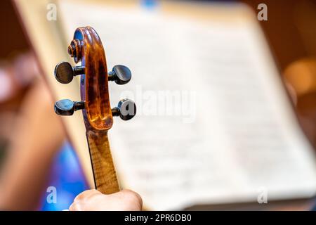 violin and sheet music at a concert in the Philharmonic Stock Photo