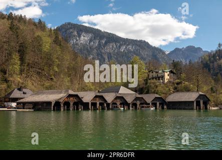Boathouses in Schoenau at lake Koenigssee in Bavaria, Germany Stock Photo