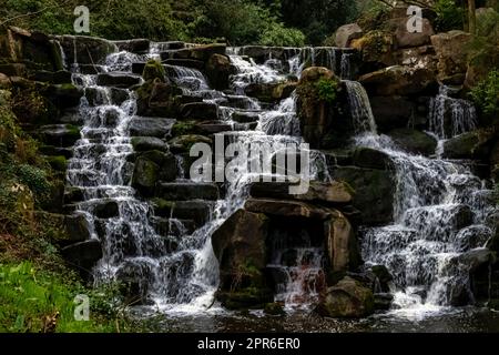 Ornamental cascade waterfall in Virginia Water, Surrey, United Kingdom Stock Photo