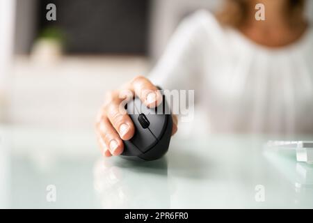 Vertical Ergonomic Optical Mouse For Carpal Tunnel Syndrome Prevention Stock  Photo - Alamy