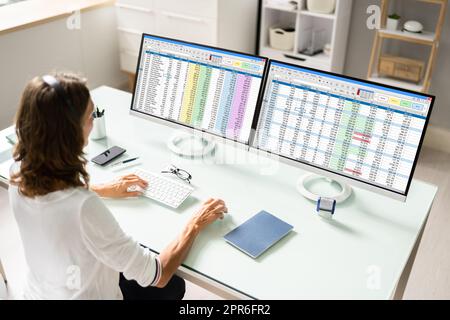Data Analyst Woman Using Spreadsheet Stock Photo