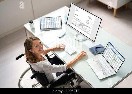 Accountant Using E Invoice Software At Computer Stock Photo