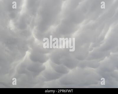 beautiful gray storm clouds arranged to rain water with wavy shapes Stock Photo