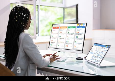 Kanban Project Management Software On Laptop Stock Photo