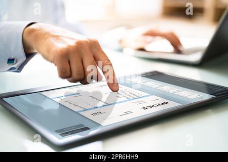 Accountant Checking E Invoice On Tablet Stock Photo