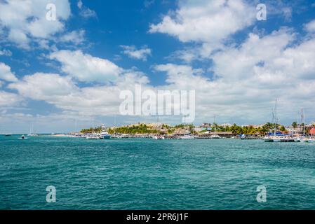 Port with sailboats and ships in Isla Mujeres island in Caribbean Sea, Cancun, Yucatan, Mexico Stock Photo