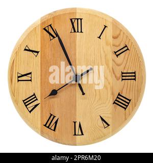 Analog round wooden clock with Roman numerals on white background. Stock Photo