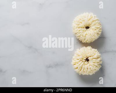 Shag donuts on marble background, copy space Stock Photo