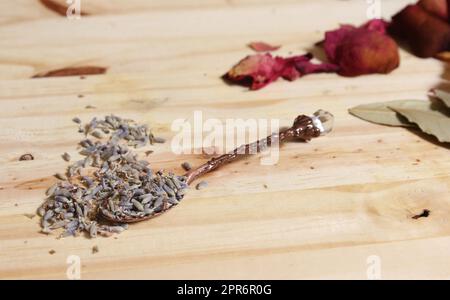 Dried Lavender and Rose Petals on Table With Incense Cones and Crystals Stock Photo