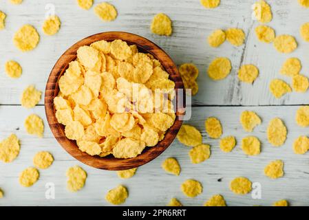 Breakfast cornflakes in a wooden bowl Stock Photo