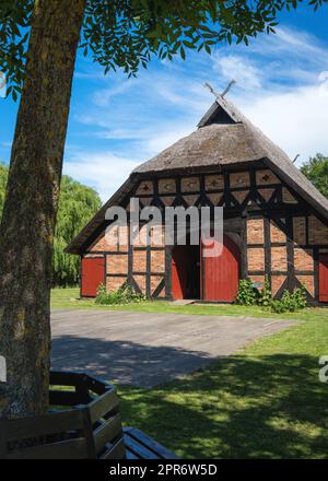 Beautiful house with a thatched roof on the Baltic Sea. Stock Photo