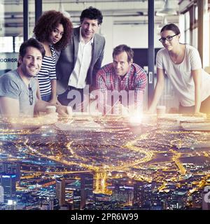 Youre looking at the best creative minds in the city. Multiple exposure shot of a group of coworkers superimposed over a city background. Stock Photo