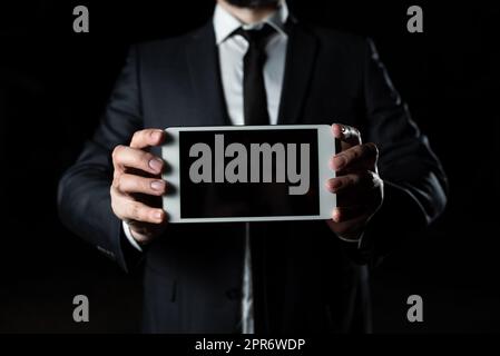 Businessman Presenting Important Informations On Phone Screen. Man In Suit Showing Crutial News On Cellphone. Executive Displaying Recent Updates On Tablet. Stock Photo