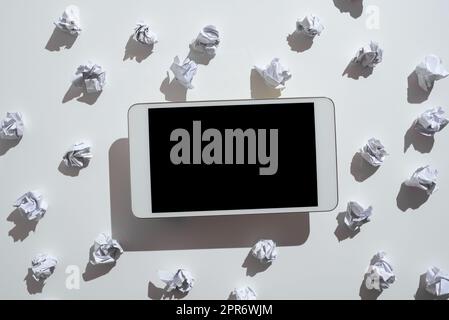 Paper Wraps Placed Around Tablet With Important Informations. Wrinkled Notes Arranged All Over Phone Screen With Crutial Announcements. Crumpled Memos With Critical Data In. Stock Photo