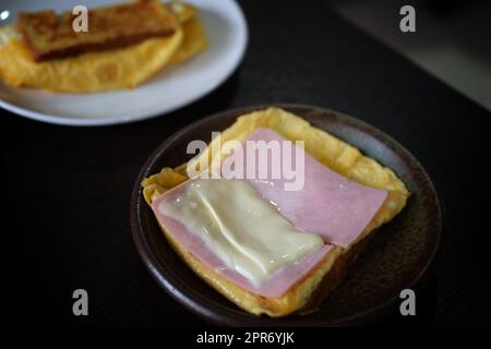 Sandwiches with egg, ham and toast cheese fried in dish Stock Photo