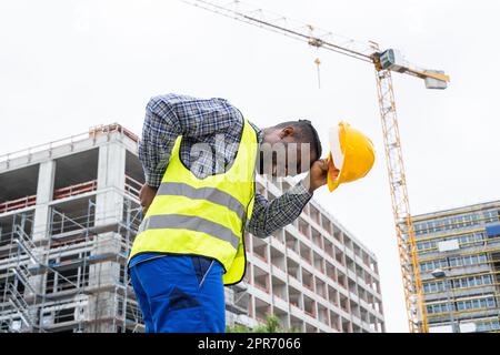 Engineer With Back Pain Injury After Accident Stock Photo