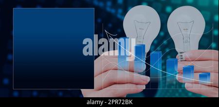 Hands Of Businesswoman Holding Light Bulbs By Digital Bar And Lines Graphs With Arrow Moving Up. Woman Presenting New Ideas And Graphical Box For Branding And Promotion. Stock Photo