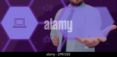 Businessman Extending Hand And Showing Digital Symbols And Laptop In A Futuristic Hive Pattern. Man With Necktie Presenting Crucial Information And Concepts In A Meeting. Stock Photo