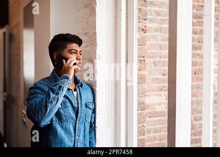 Positive European Caucasian guy standing against wall in relaxed convenient  pose Stock Photo | Adobe Stock