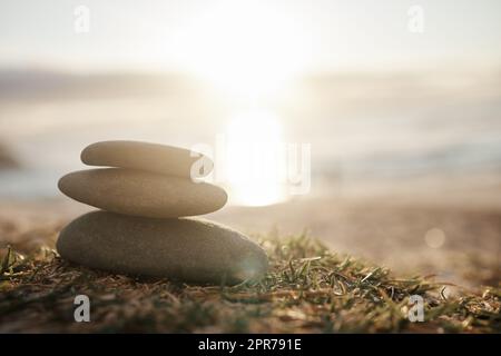 May peace be with you. Closeup shot of a stack of stones on the beach. Stock Photo